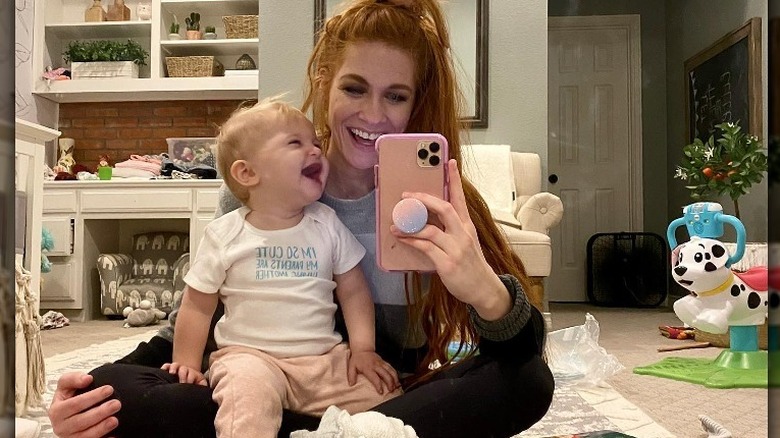 Jenn Todryk taking a selfie with her baby