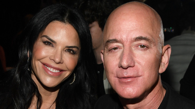 Jeff Bezos and Lauren Sanchez at a fashion show 