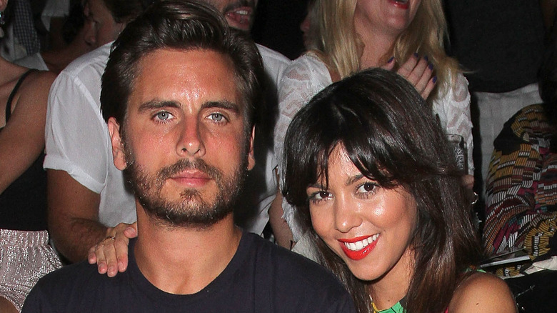 Kourtney Kardashian and Scott Disick holding hands