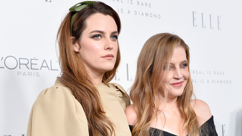 Riley Keough and Lisa Marie Presley smiling at red carpet event