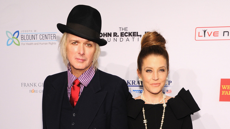 Michael Lockwood and Lisa Marie Presley standing at red carpet event