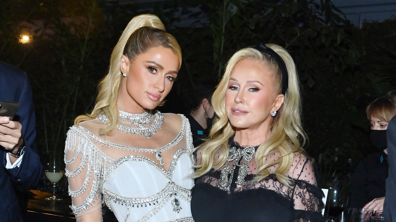 Paris Hilton and Kathy Hilton standing together in November 2021