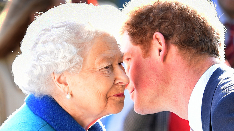 Prince Harry kissing Queen Elizabeth in 2015.