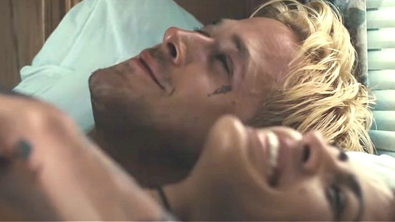 Ryan Gosling and Eva Mendes laughing in bed