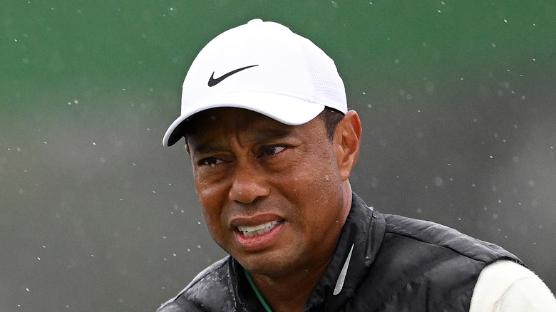 Tiger Woods squinting in rain