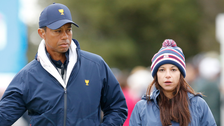 Tiger Woods and Erica Herman walking