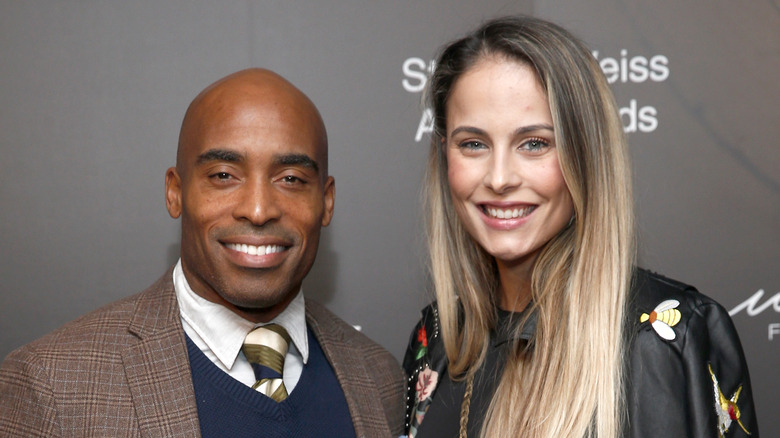 Tiki Barber posing with Traci Johnson on the red carpet