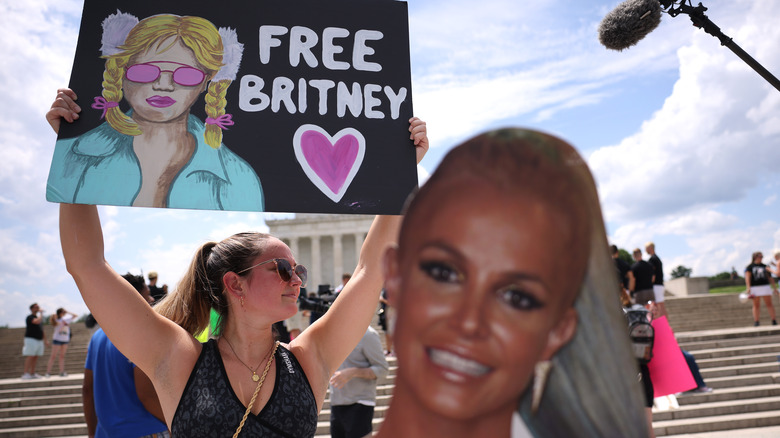 fan with free Britney sign at protest