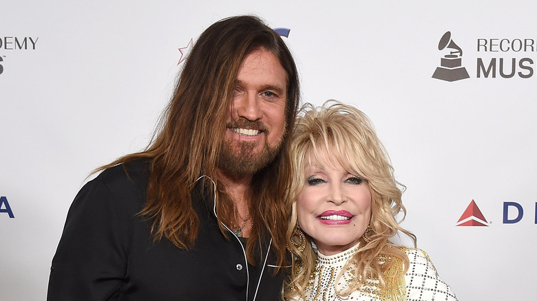 Billy Ray Cyrus and Dolly Parton smiling