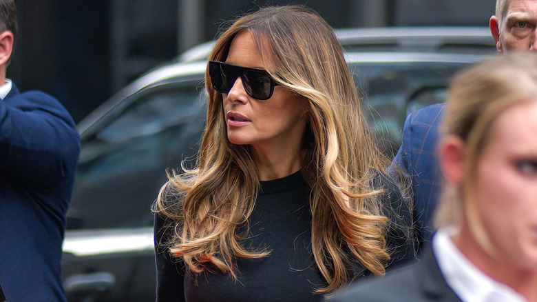 Melania Trump walking with shades