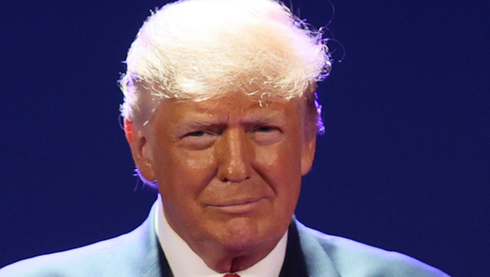 Donald Trump gives a wry smile