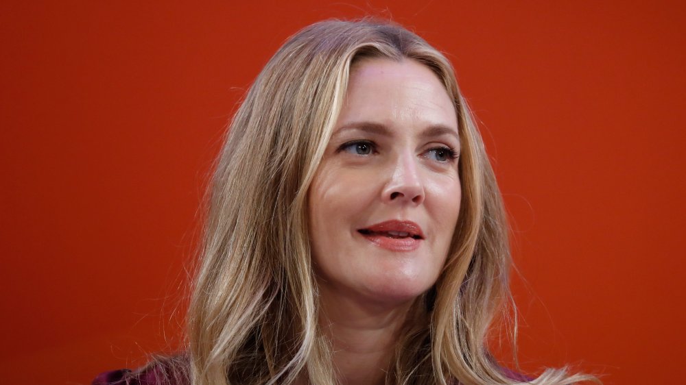 Drew Barrymore speaking on a panel in 2016