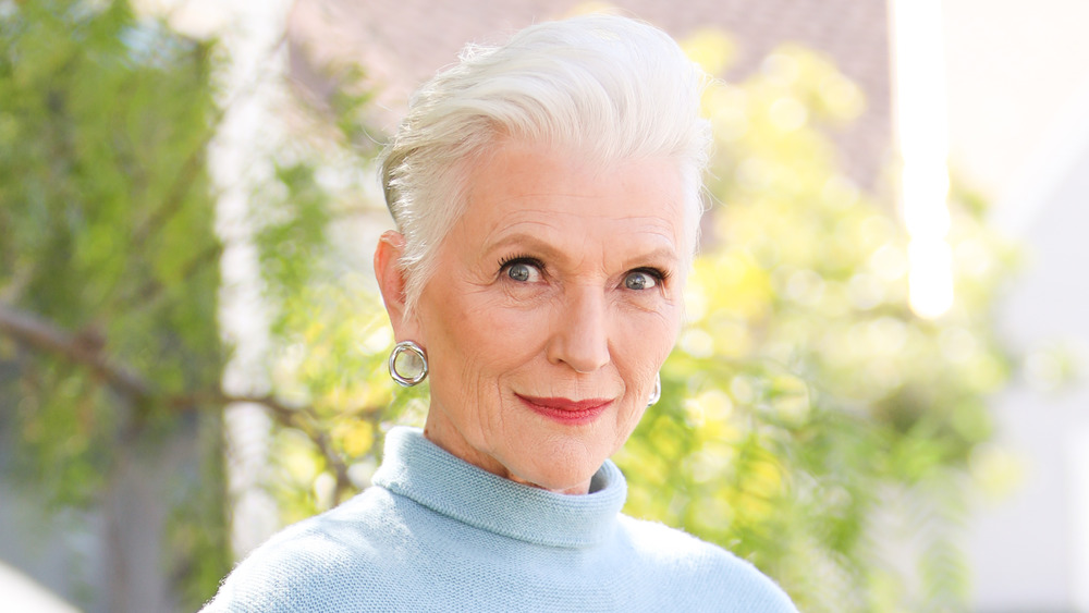 Maye Musk smiling with trees in the background