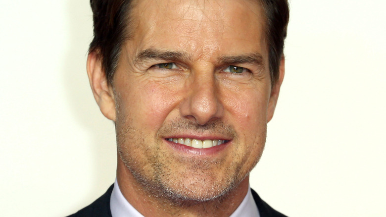 Tom Cruise smiling at a premiere