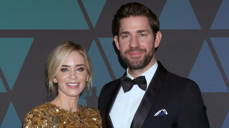 Emily Blunt and John Krasinski pose at an event