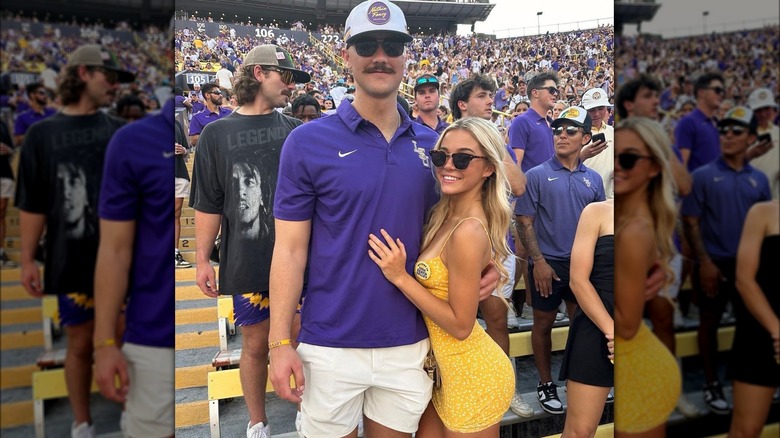 Paul Skenes and Olivia Dunne stand in a crowd