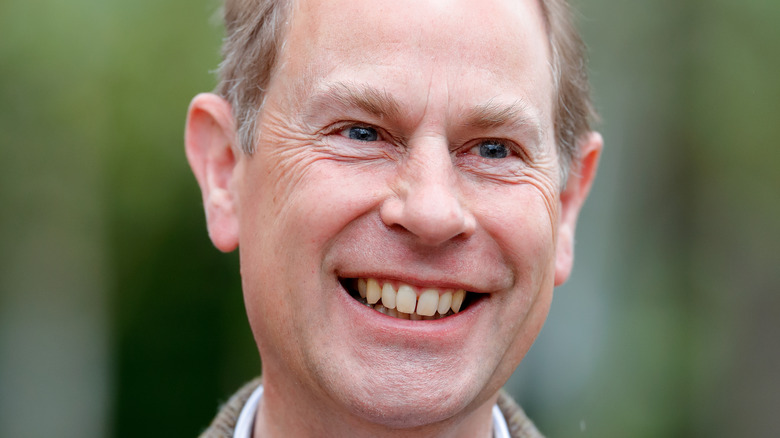 Prince Edward at an event, big smile