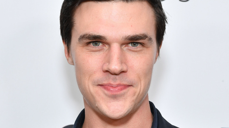 Finn Wittrock posing