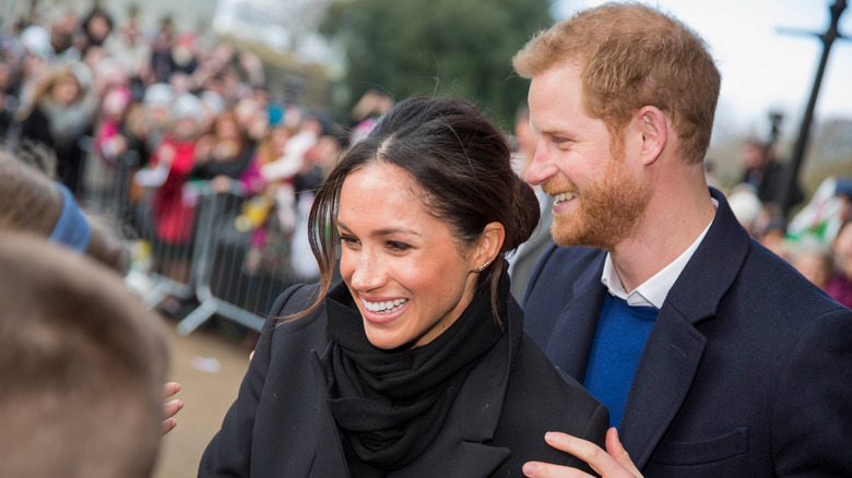 Meghan Markle and Prince Harry greeting onlookers