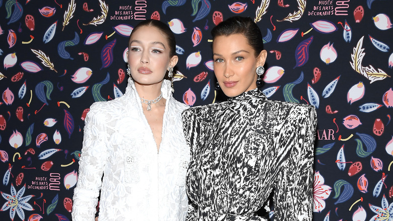 Gigi and Bella Hadid hugging on red carpet