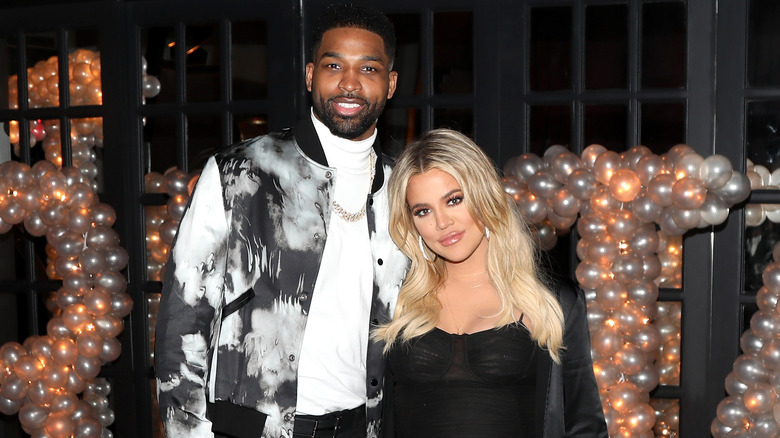 hloe Kardashian and Tristan Thompson pose 