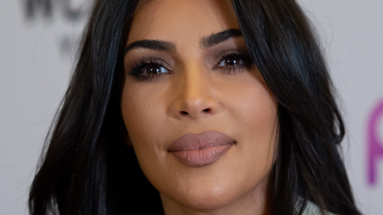 Kim Kardashian smiles at an event