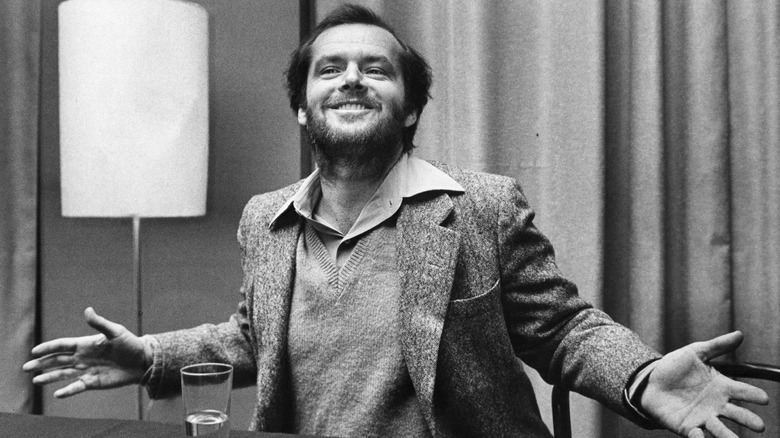 Jack Nicholson posing with arms slightly raised