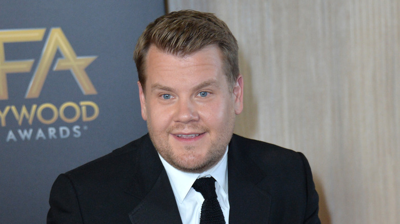 James Corden posing on red carpet 