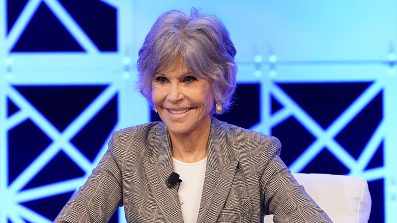 Jane Fonda seated in an armchair