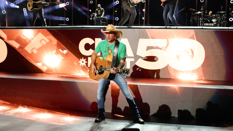 Jason Aldean performing with guitar