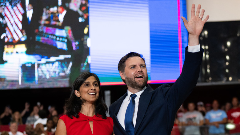 Usha Vance and JD Vance with his hand raised