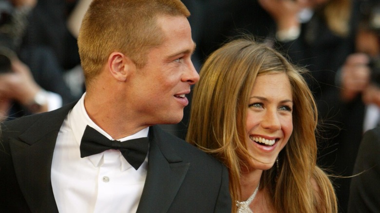 Brad Pitt and Jennifer Aniston pose on the red carpet