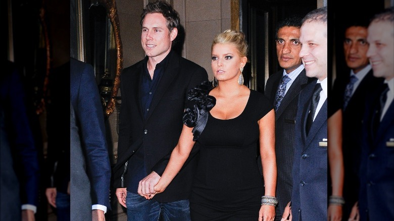 Jessica Simpson holding hands with Eric Johnson