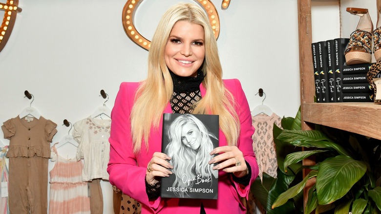 Jessica Simpson holding Open Book