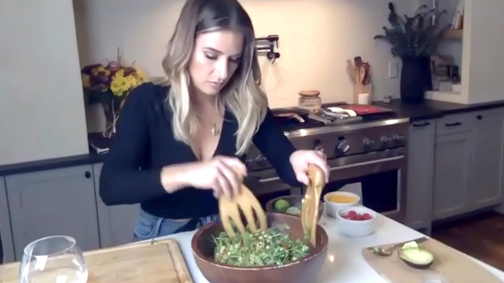 Jessie James Decker tossing a salad