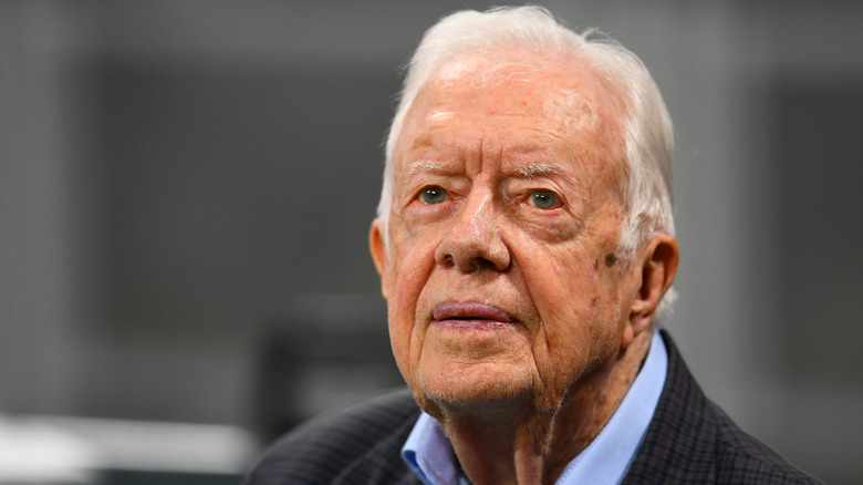 Jimmy Carter watching a game at Mercedes-Benz stadium