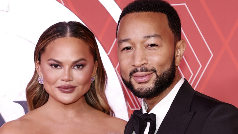 John Legend, Chrissy Teigen, posing together