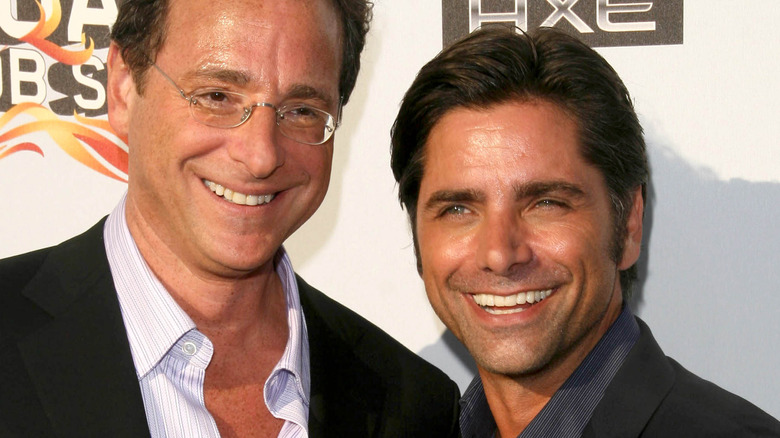 Bob Saget and John Stamos smiling big together