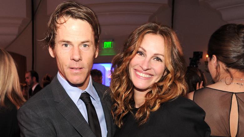 Julia Roberts smiles next to Danny Moder