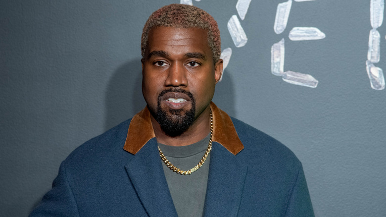 Kanye West, posing on red carpet