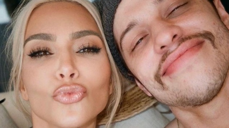 Kim Kardashian blowing kiss Pete Davidson smiling