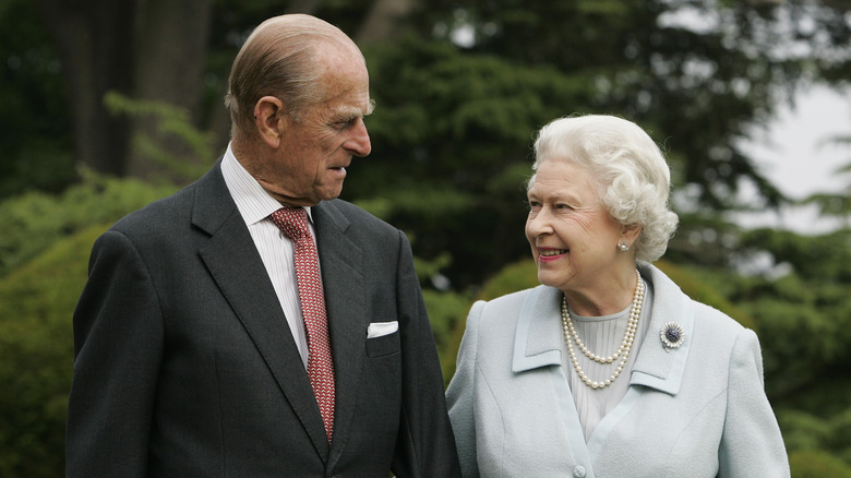 Queen Elizabeth Prince Philip looking at each other