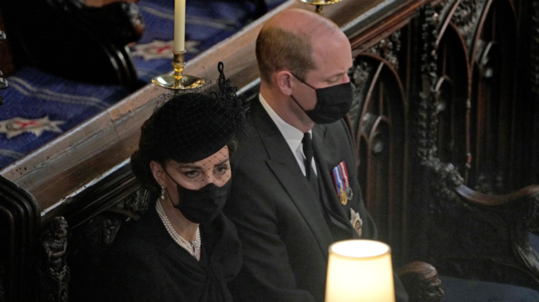 Kate Middleton and Prince William sitting in St. George's Chapel