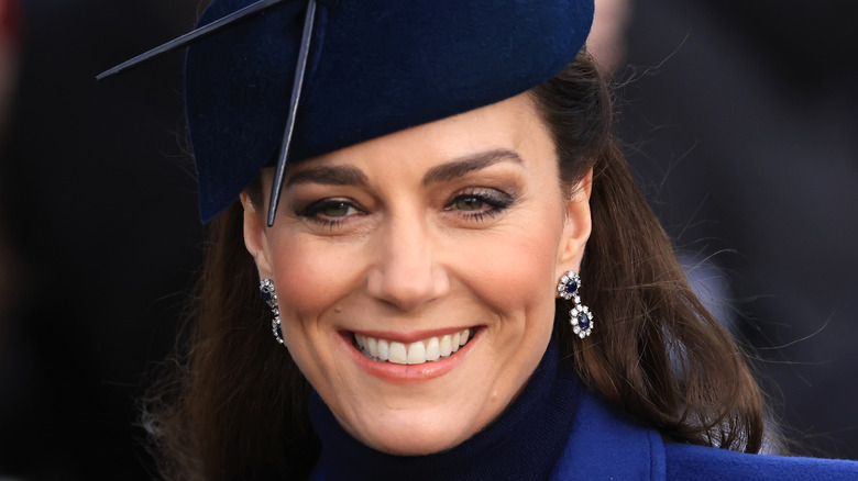 Kate Middleton smiles in a hat