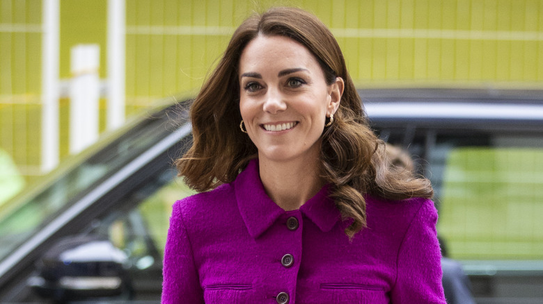 Kate Middleton walking in pink coat