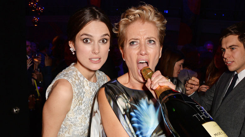 Keira Knightley posing with Emma Thompson champagne