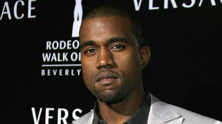 Kanye West with a serious expression