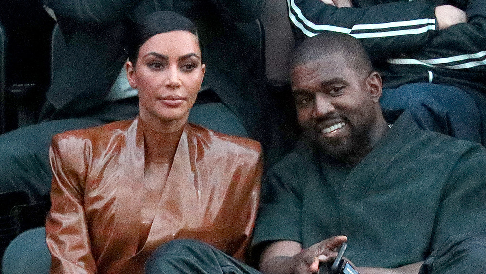 Kim Kardashian and Kanye West at a basketball game