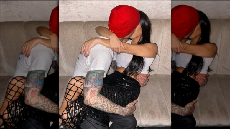 Travis Barker and Kourtney Kardashian kissing