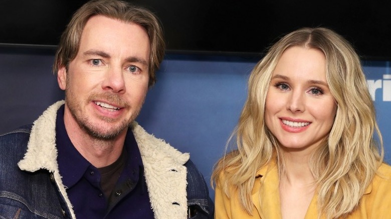 Dax Shepard smiling with Kristen Bell